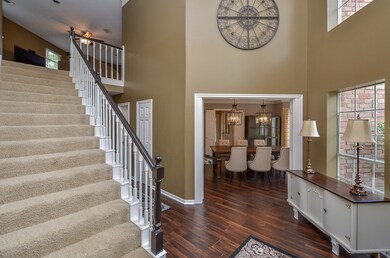 To the right of the large, welcoming entry is the formal dining room.