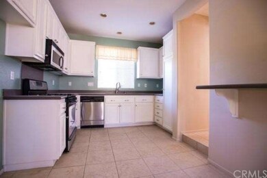 Kitchen with stainless steel appliances.