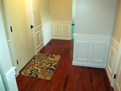 Lovely entry foyer with hardwood floors.  Custom w
