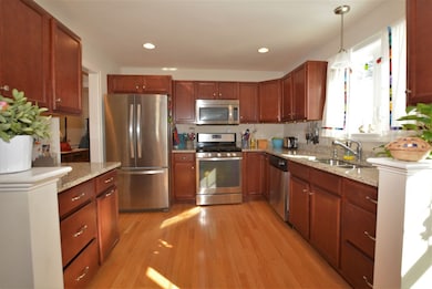 Upgraded kitchen with granite counters, stainless 