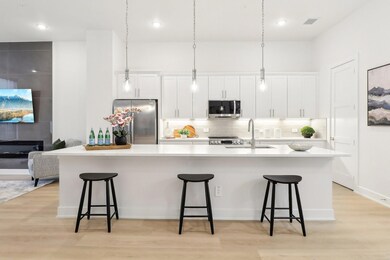 Kitchen featuring light wood finished floors, a sp