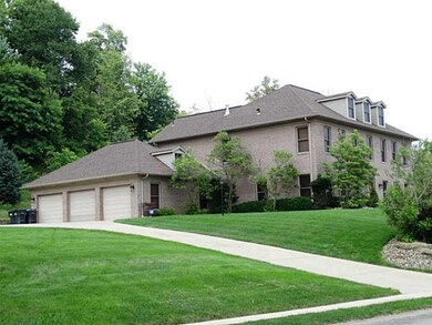 Exterior Front. A large 3 car garage with extended