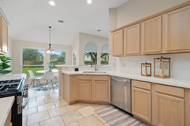 Quartz countertops and white subway tile backsplas