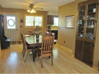 Beautiful Maple floors with knotty pine trim.