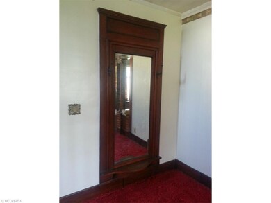 Framed mirror in parlor room area located on the s