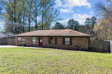 Ranch-style house featuring a front lawn