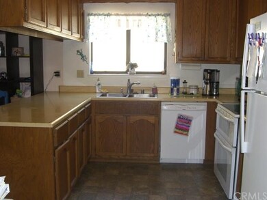 Kitchen with lots of wood cabinets for storage and