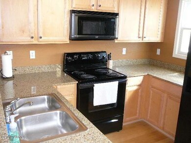 Maple cabinets and Black appliances