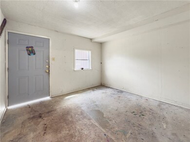Entrance foyer featuring a textured ceiling and co