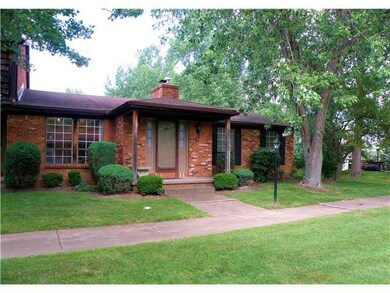 Exterior Front. Lovely treed lot with privacy.  Al