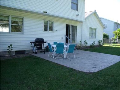 Exterior Back. Sliding doors to back yard patio.
