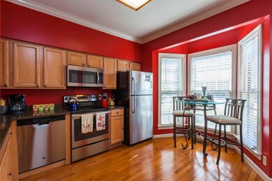 The kitchen has all stainless steel appliances, two pantries, bay windows, and hardwoods!