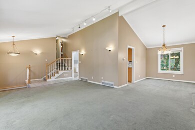 Living room with carpet flooring, ornamental molding, high vaulted ceiling, stairs, and beamed ceiling