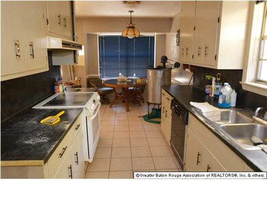 Galley kitchen has breakfast area