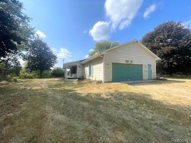 View of property exterior featuring a yard