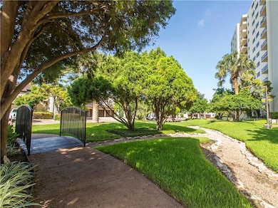 View of home's community with a yard