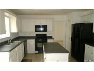 Large kitchen with island and 6 burner gas stove