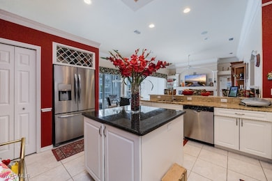 Kitchen featuring light tile patterned floors, whi