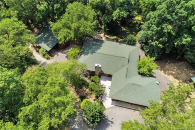 Over view of Log house on right and guest house on