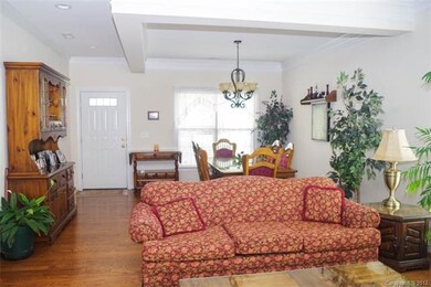 Beautiful open floor plan with hard wood flooring.