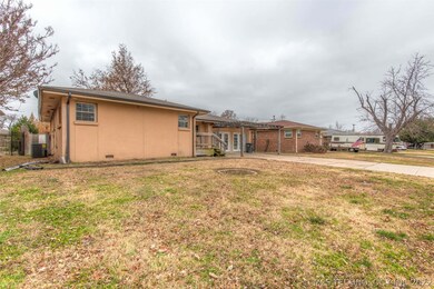 Large front yard and wide driveway. Charming pergo