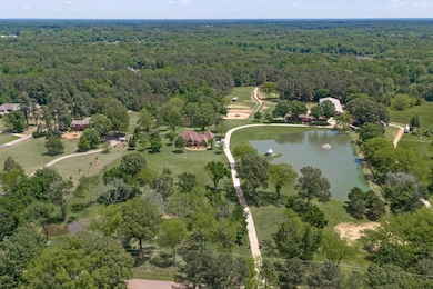 Aerial view of property's location with a forest a