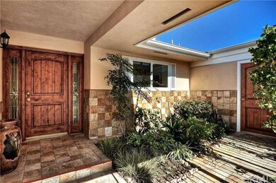 Beautiful custom front door on left, with secondar