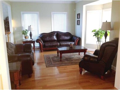 Living Room. The hardwood floors continue into the