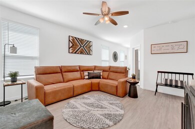 This spacious living room features high ceilings,