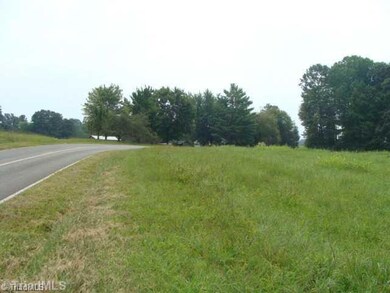 Land. Hundreds of feet of Wonderful, Rural, Paved road frontage!