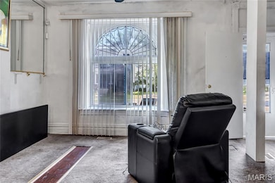 Living area featuring carpet