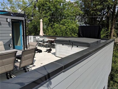 Rooftop picture shows similar unit to give buyer i