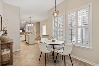 Dining area featuring stairs, light tile patterned