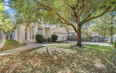 View of front of home with driveway, brick siding, and a garage