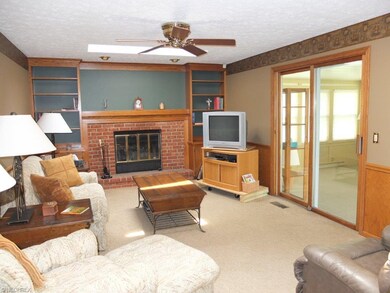Family room with skylights and fireplace.