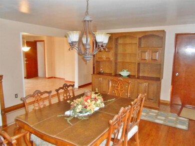 Dining room with wall unit included.