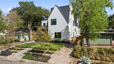 Contemporary home with stucco siding, a front law