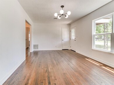 Large picture windows flood the space with natural light and warmth.