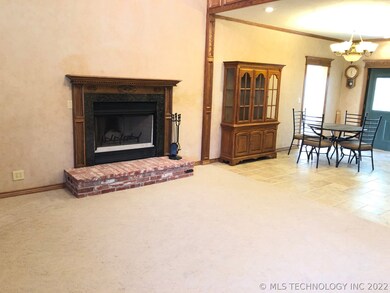 OPEN FLOOR PLAN AND FIREPLACE IN LIVING ROOM
