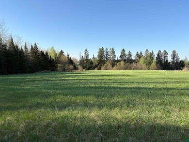 View of grassy yard with a view of countryside