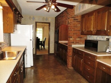 Kitchen with Smooth Cooktop in Brick Surround, Dou