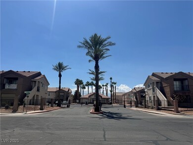 View of asphalt street featuring sidewalks, curbs,