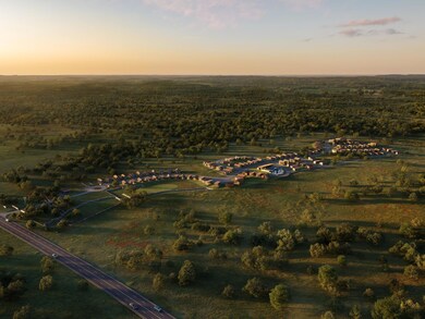 Aerial view at dusk featuring a rural view