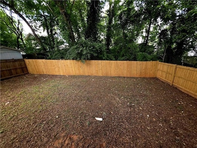 View of fenced backyard