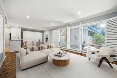 This bright and airy living area seamlessly connec