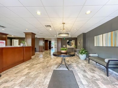 Welcome area featuring a chandelier, recessed lig