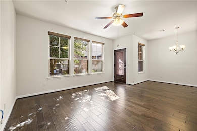 Spare room with baseboards, ceiling fan with nota