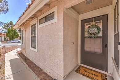 View of exterior entry featuring stucco siding