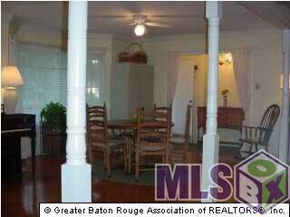 Open Floor Plan with Wood Floors in Dining Room