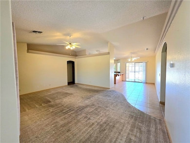 Living room with carpet, open to the diving room